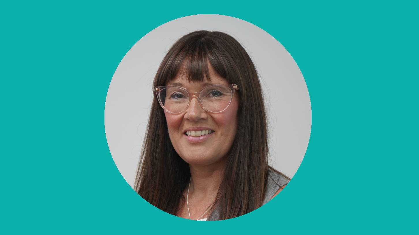 A woman smiling at the camera