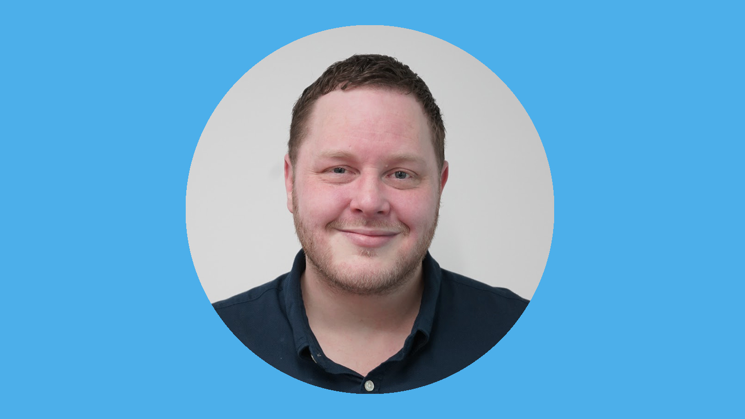 A man smiling at the camera