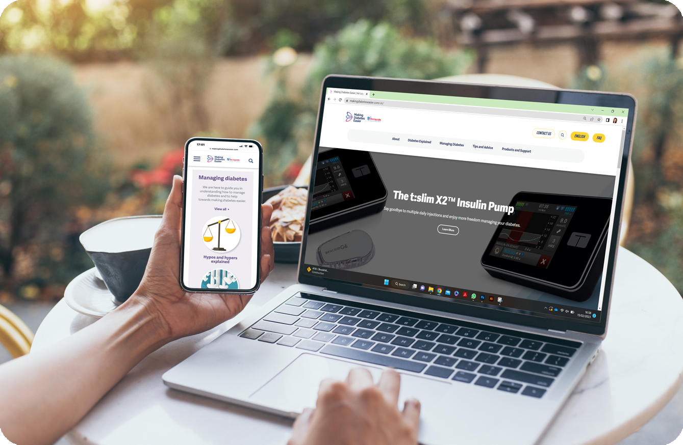 A laptop showing the tslim website with a phone and a pump in the reflection of the laptop screen.