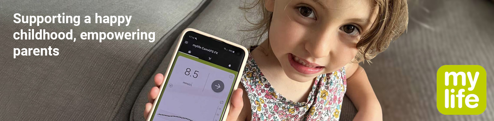 A girl is holding up a phone showing her glucose reading. The image reads, 'Supporting a happy childhood, empowering parents', and 'Mylife loop for young people.'