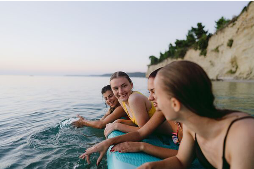 young people paddleboarding