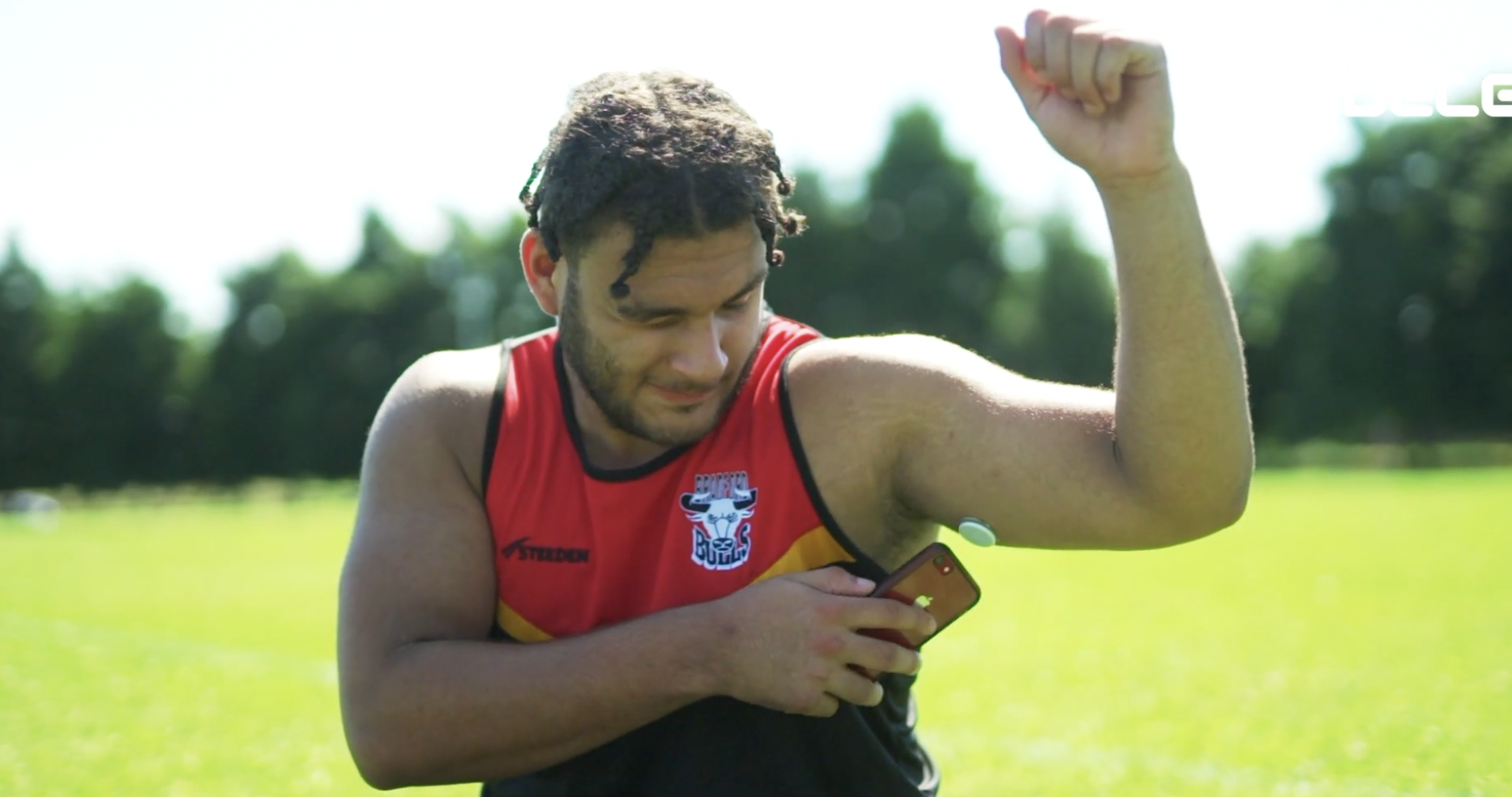 a young man uses flash to read his glucose level